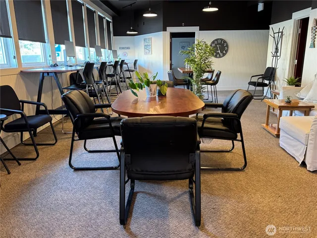 a view of a house with a door and wooden walls