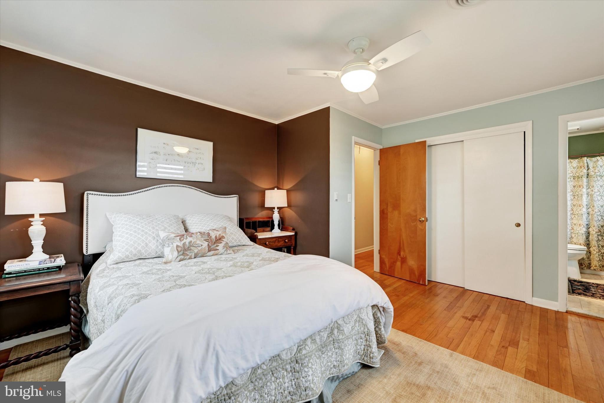 13324 Manor Road Baldwin, MD 21013 - Photo 16 of 34 a bedroom with a bed and wooden floor