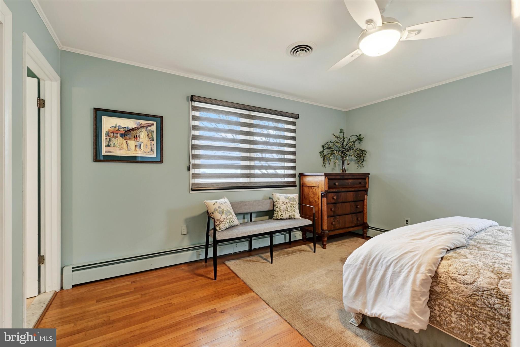 13324 Manor Road Baldwin, MD 21013 - Photo 17 of 34 a bedroom with a bed and a bookshelf