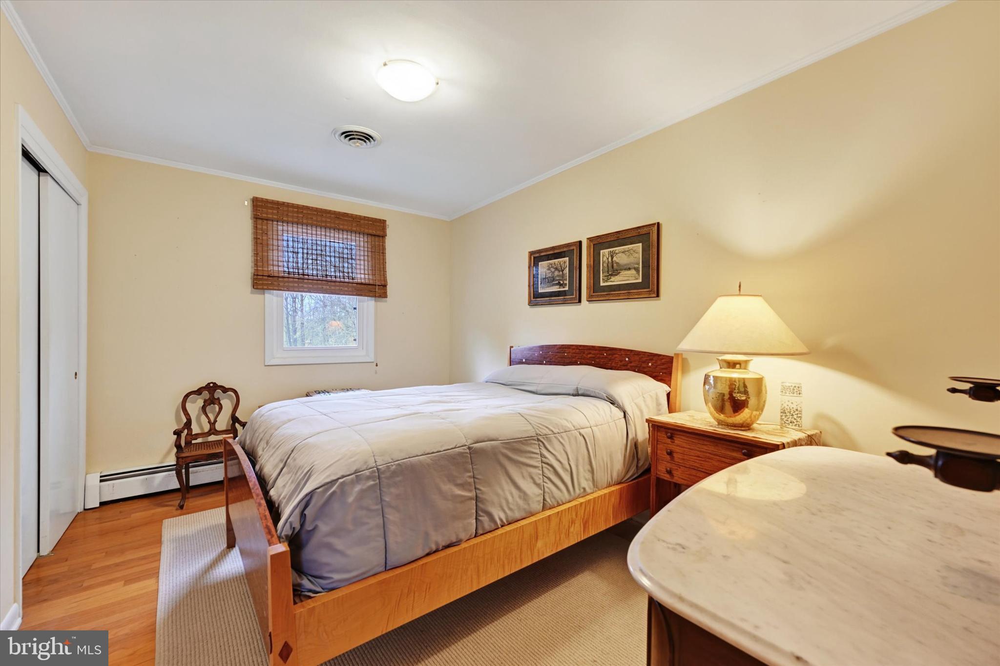 13324 Manor Road Baldwin, MD 21013 - Photo 18 of 34 a bedroom with two beds and painting on the wall