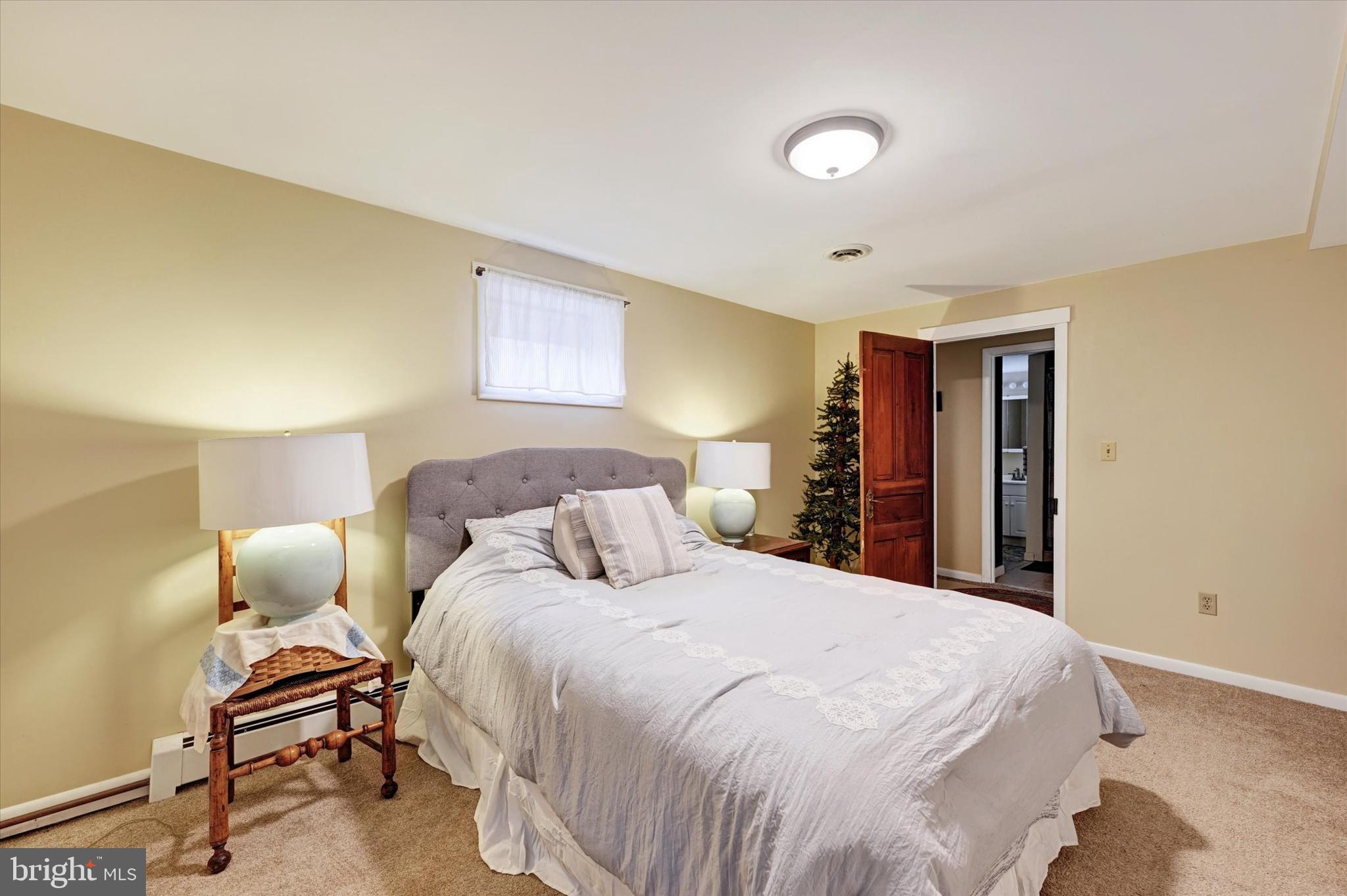 13324 Manor Road Baldwin, MD 21013 - Photo 23 of 34 a bed room with a bed and a chair