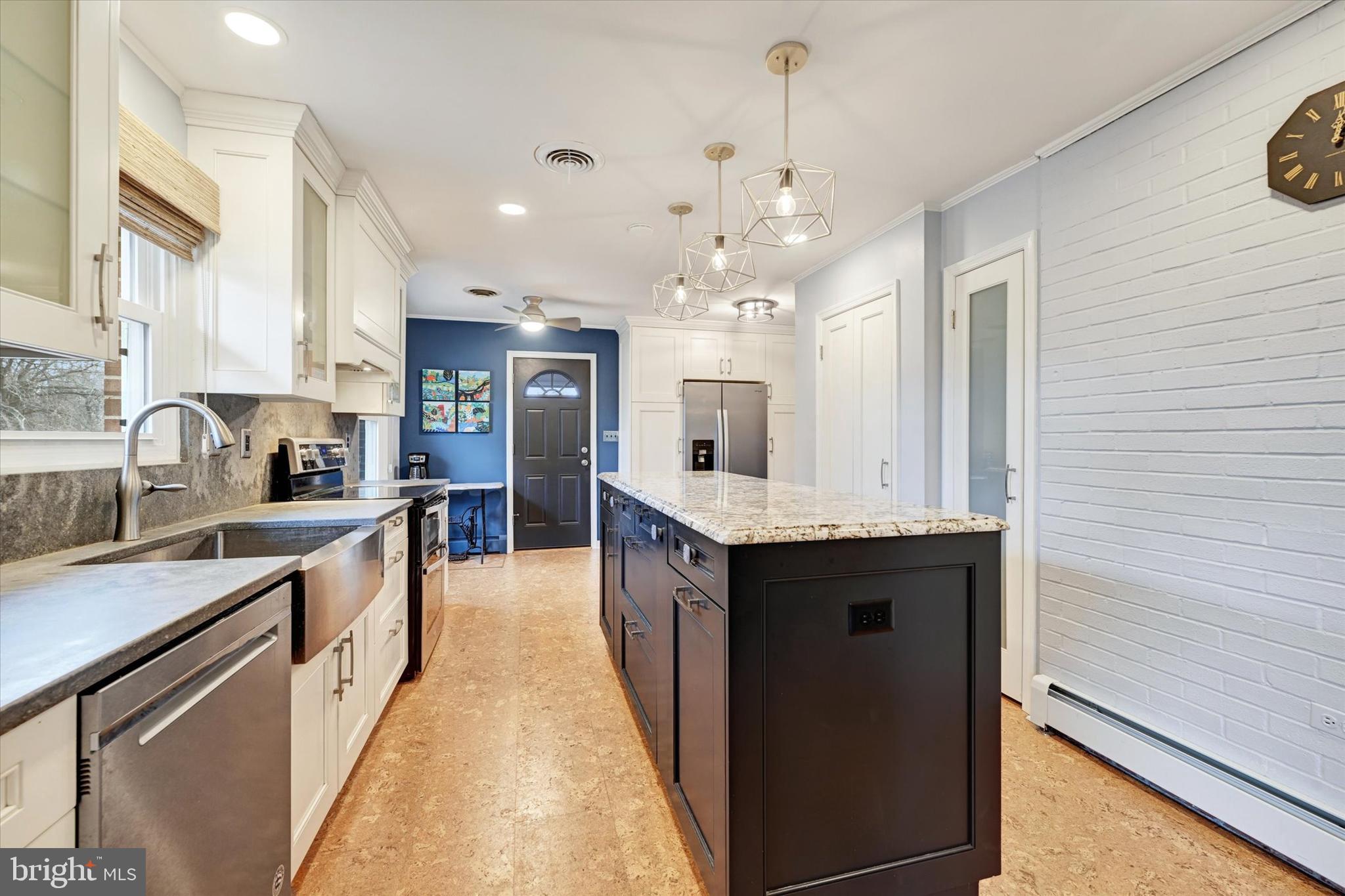 13324 Manor Road Baldwin, MD 21013 - Photo 9 of 34 a large kitchen with granite countertop a large center island in it
