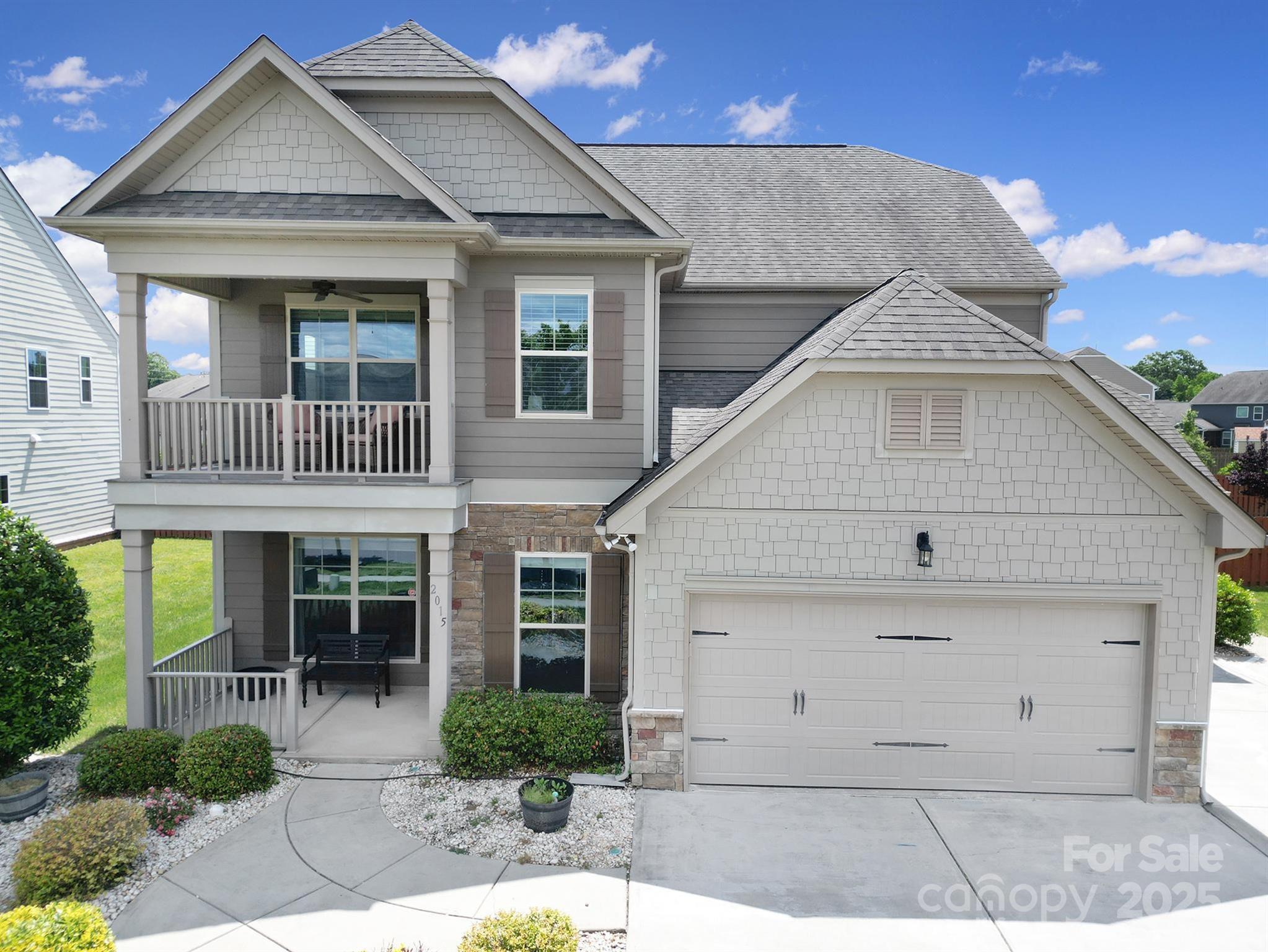 2015 Knocktree Drive Indian Trail, NC 28079 - Photo 1 of 45 a front view of a house with a yard and potted plants