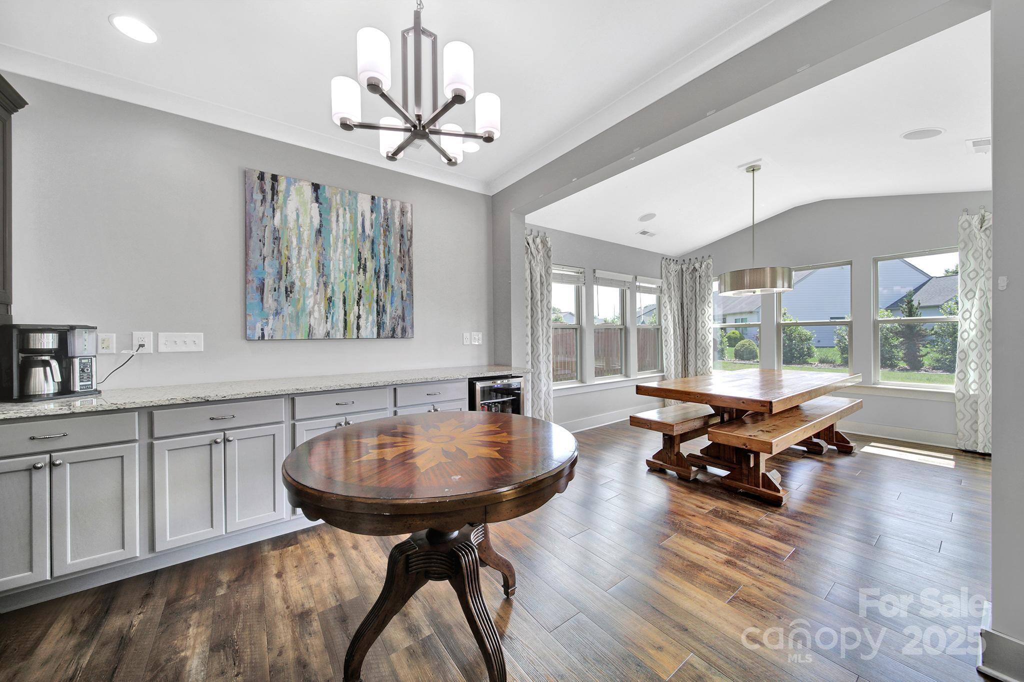 2015 Knocktree Drive Indian Trail, NC 28079 - Photo 11 of 45 a living room with furniture a window and a chandelier
