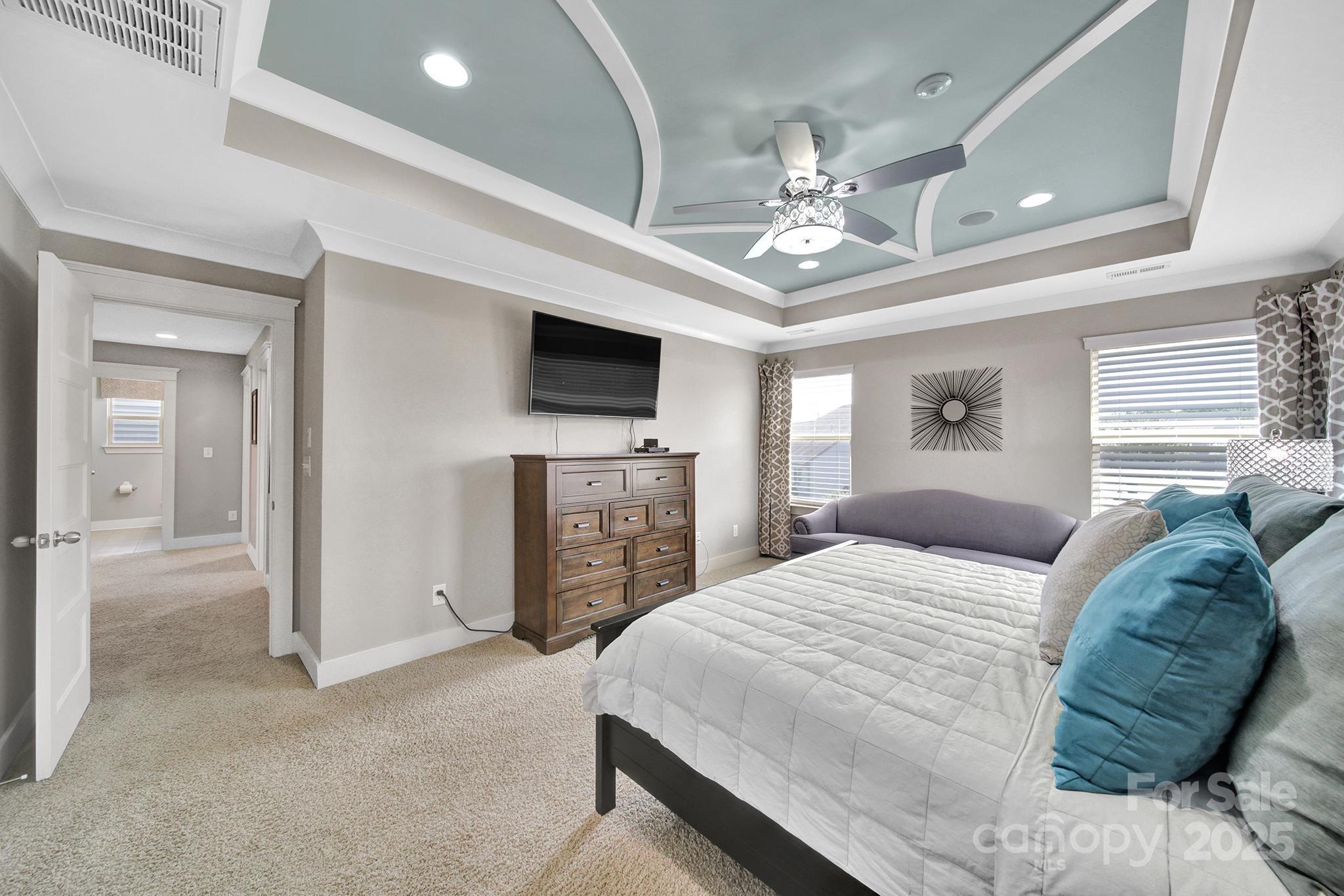 2015 Knocktree Drive Indian Trail, NC 28079 - Photo 21 of 45 a spacious bedroom with a bed and a flat screen tv