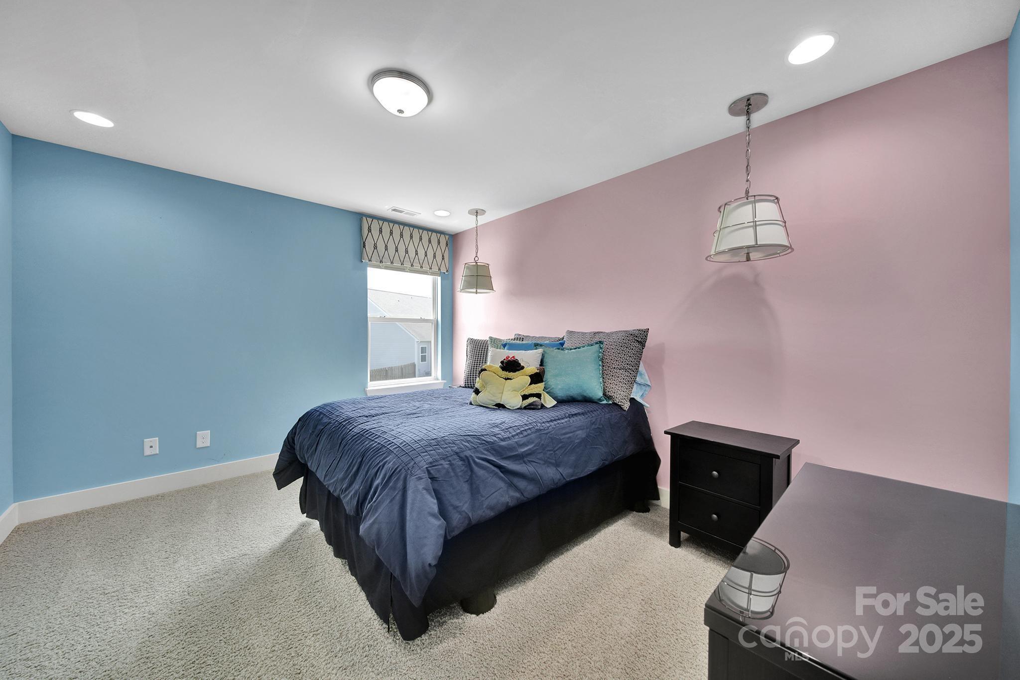 2015 Knocktree Drive Indian Trail, NC 28079 - Photo 24 of 45 a bedroom with a bed and window