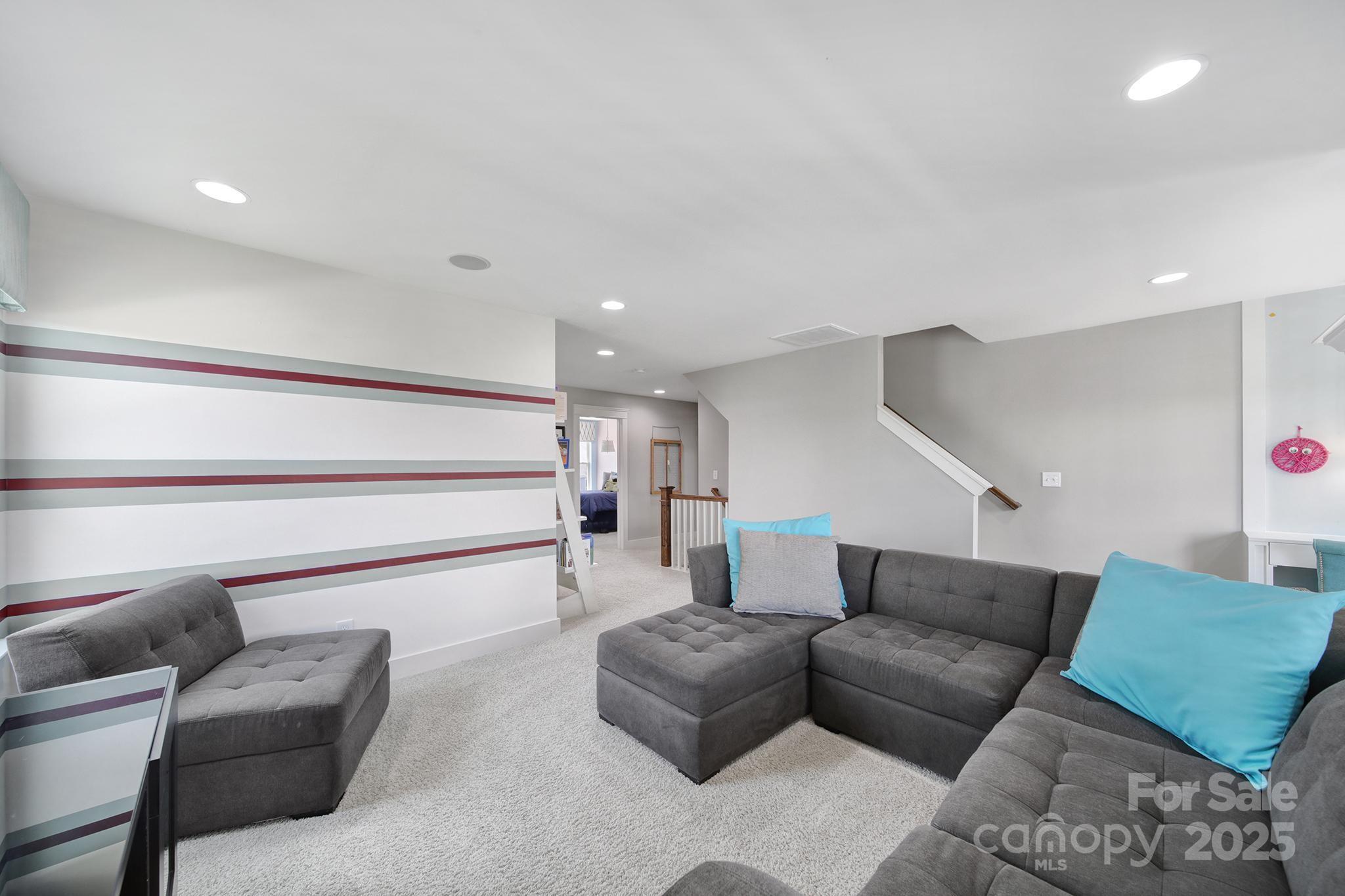 2015 Knocktree Drive Indian Trail, NC 28079 - Photo 30 of 45 a living room with furniture and a ceiling fan