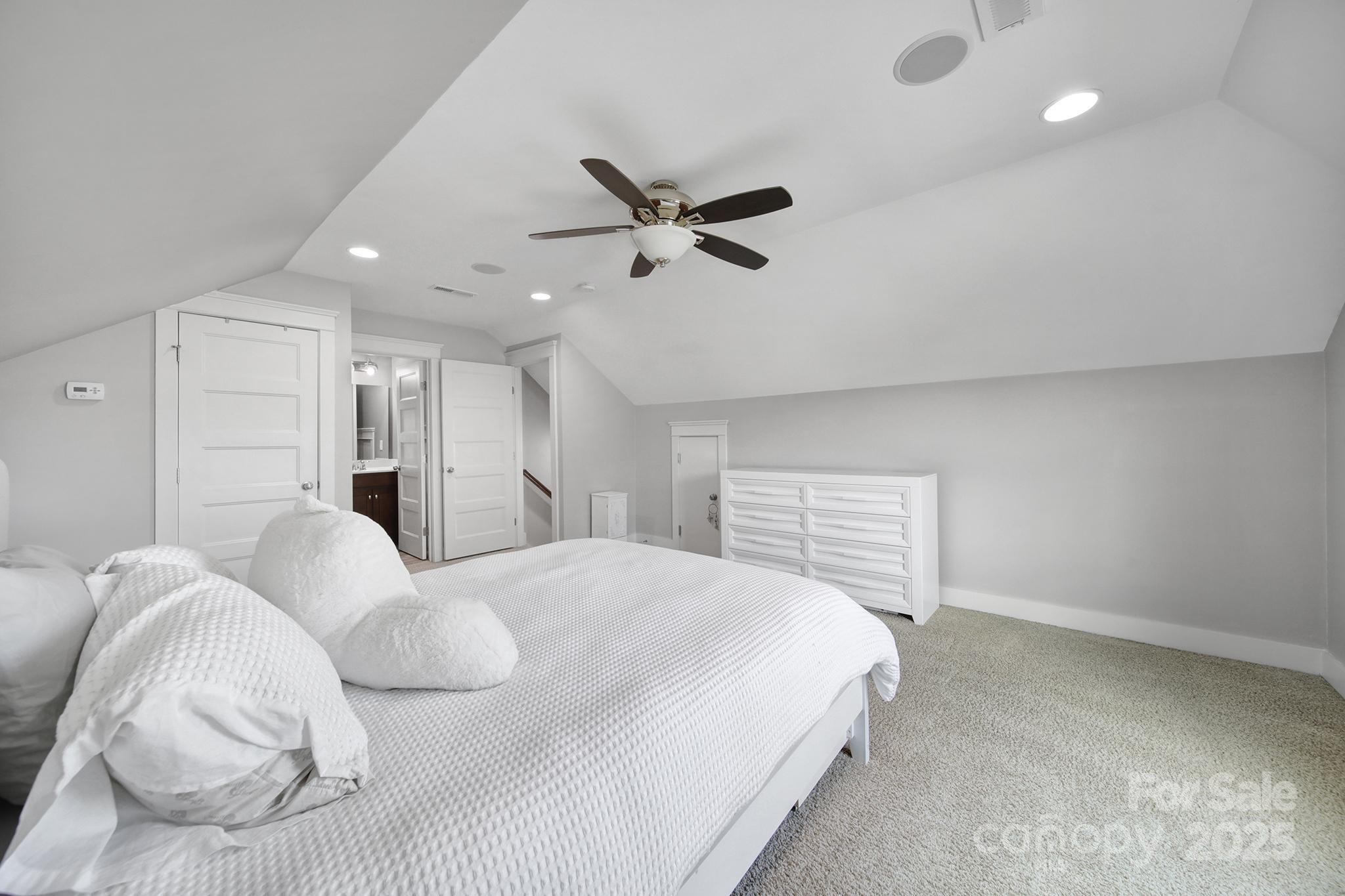 2015 Knocktree Drive Indian Trail, NC 28079 - Photo 34 of 45 a bedroom with a bed and a ceiling fan