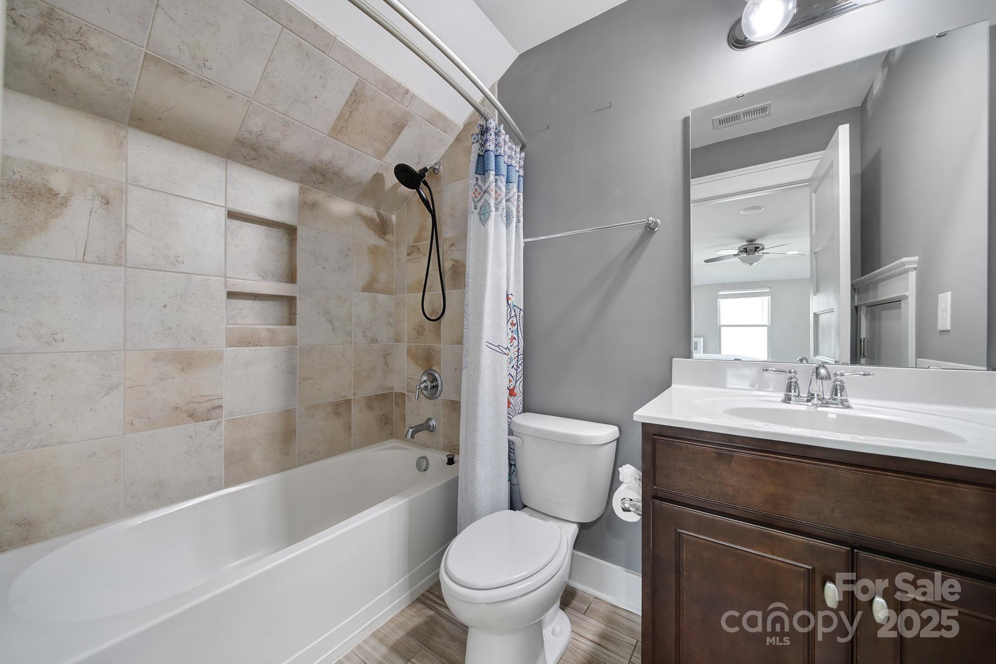 2015 Knocktree Drive Indian Trail, NC 28079 - Photo 35 of 45 a bathroom with a granite countertop sink toilet and shower