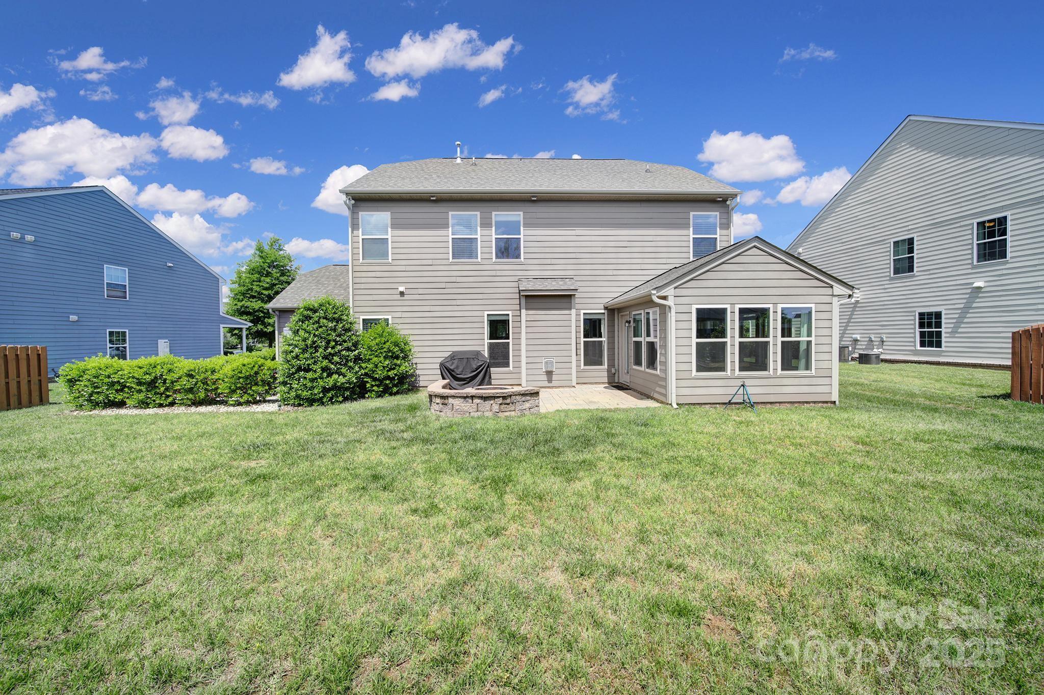 2015 Knocktree Drive Indian Trail, NC 28079 - Photo 37 of 45 a front view of a house with a garden