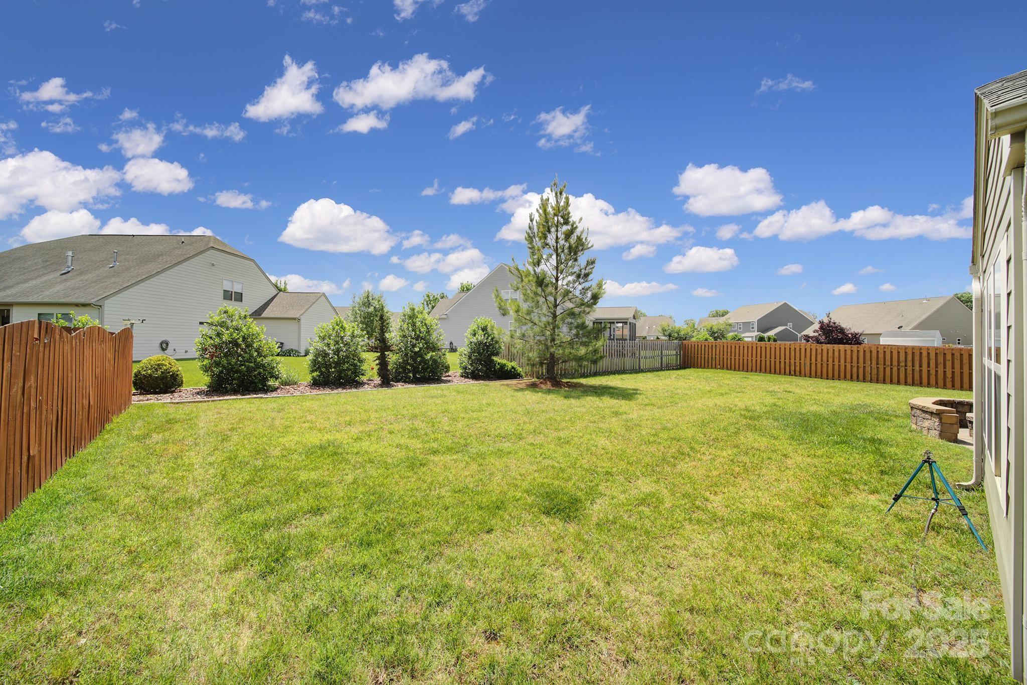 2015 Knocktree Drive Indian Trail, NC 28079 - Photo 38 of 45 a view of a fountain in front of a house with a big yard