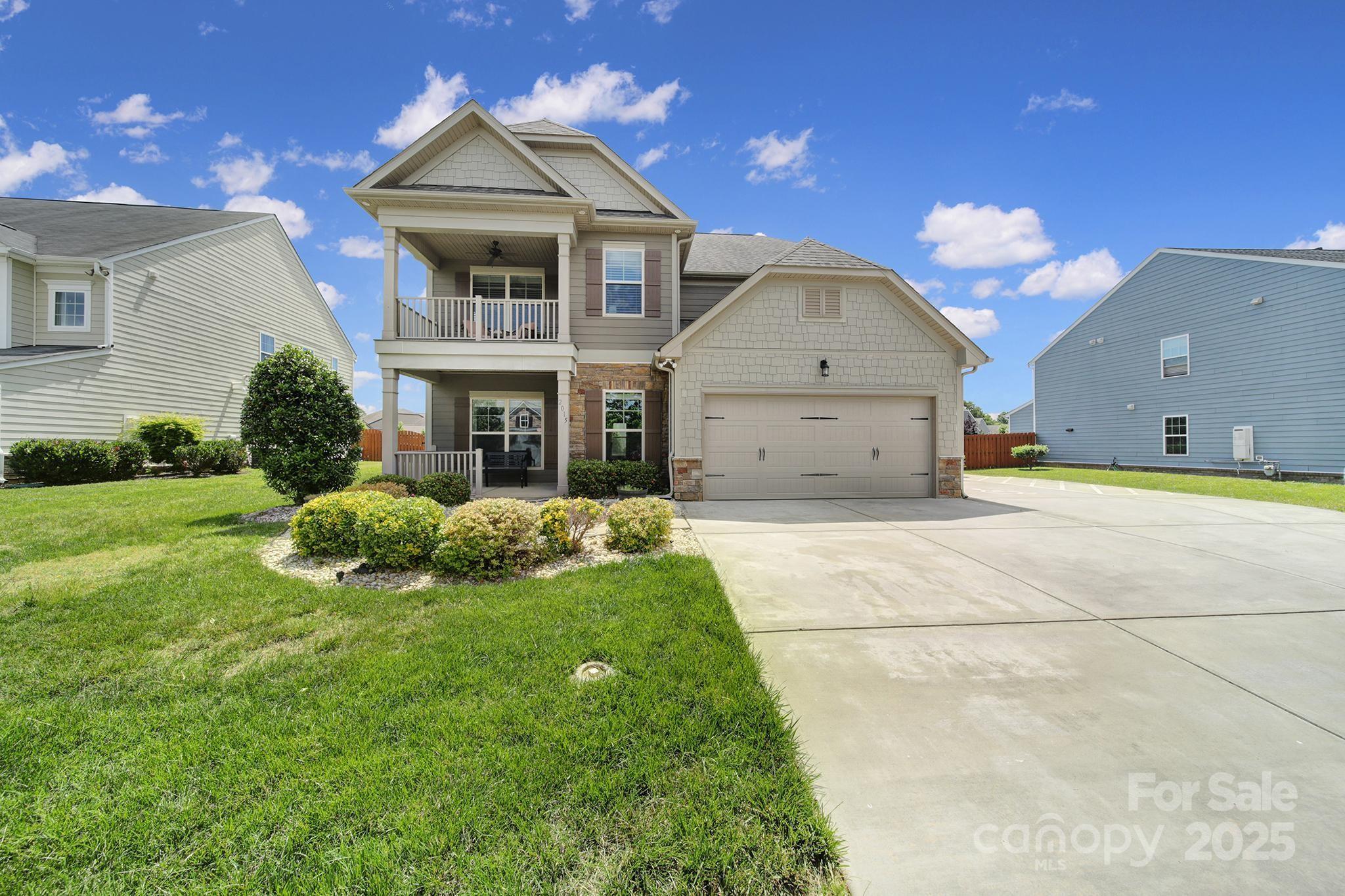 2015 Knocktree Drive Indian Trail, NC 28079 - Photo 39 of 45 a front view of a house with garden