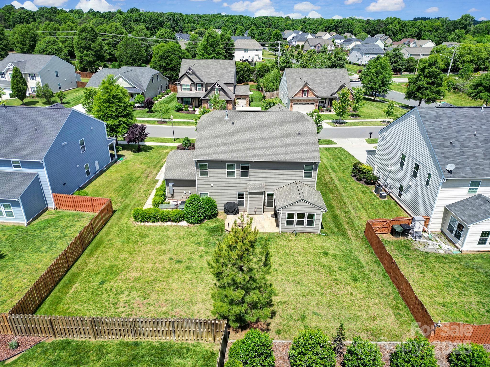 2015 Knocktree Drive Indian Trail, NC 28079 - Photo 41 of 45 an aerial view of multiple houses with yard