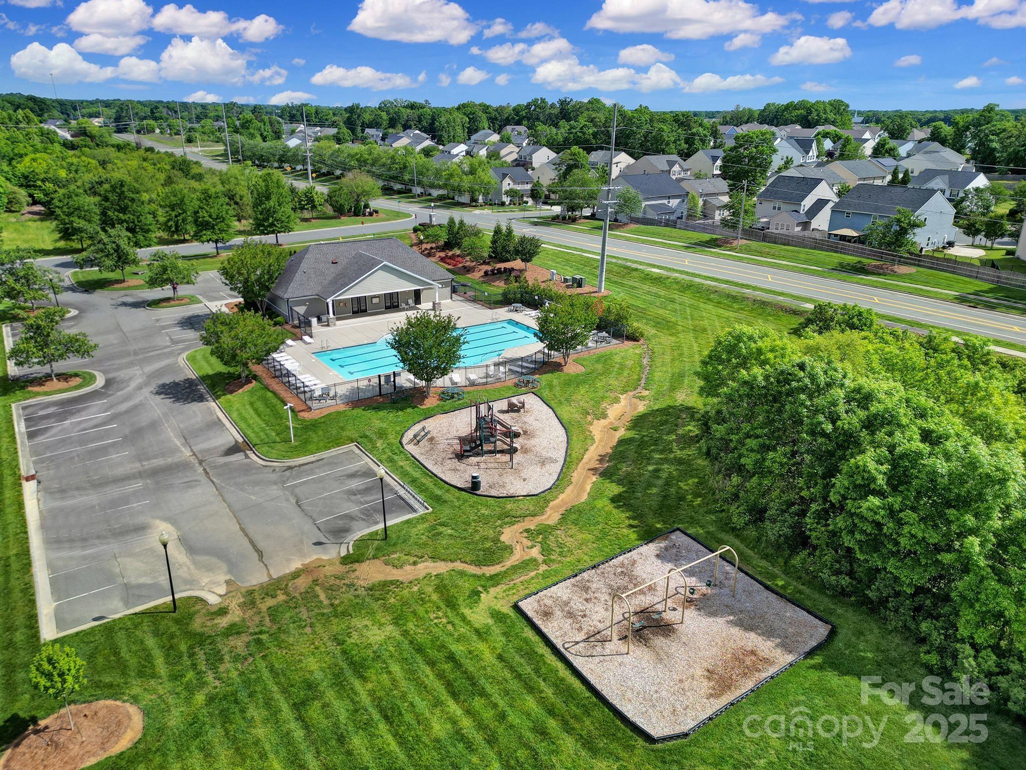 2015 Knocktree Drive Indian Trail, NC 28079 - Photo 45 of 45 an aerial view of a house with a garden and lake view