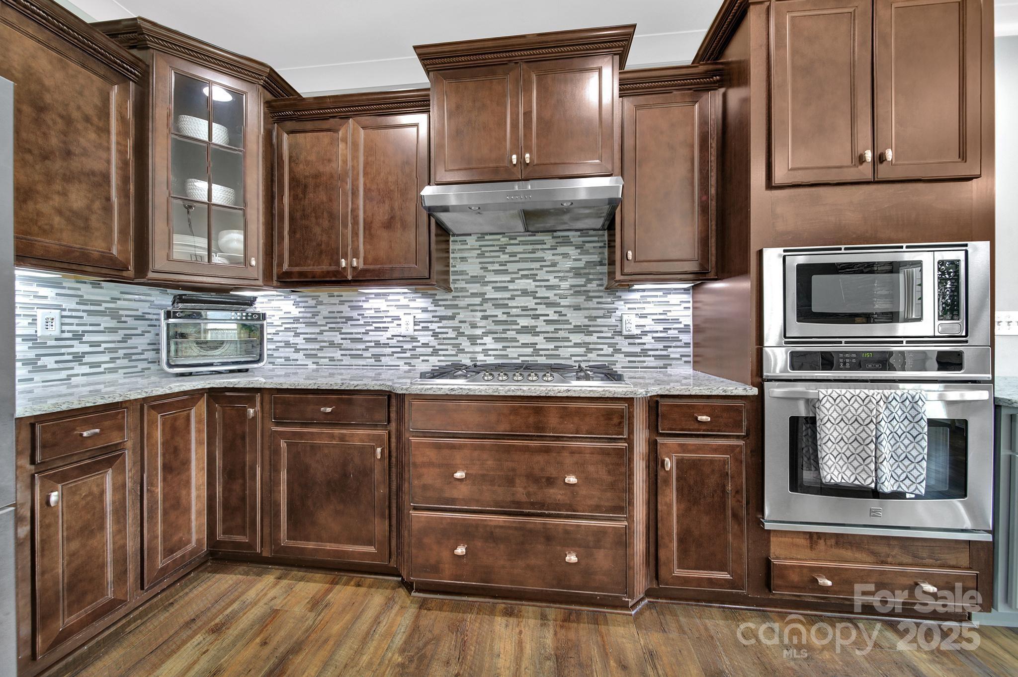 2015 Knocktree Drive Indian Trail, NC 28079 - Photo 10 of 45 a kitchen with stainless steel appliances granite countertop a refrigerator and a sink