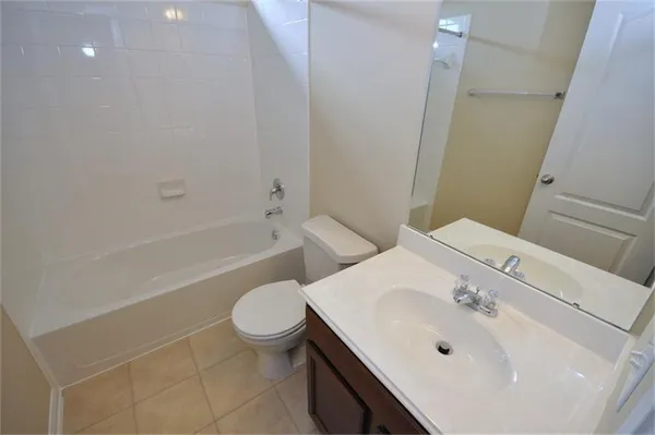 a bathroom with a sink a toilet and a bathtub