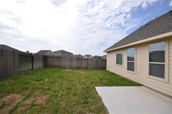 a view of a back yard of the house