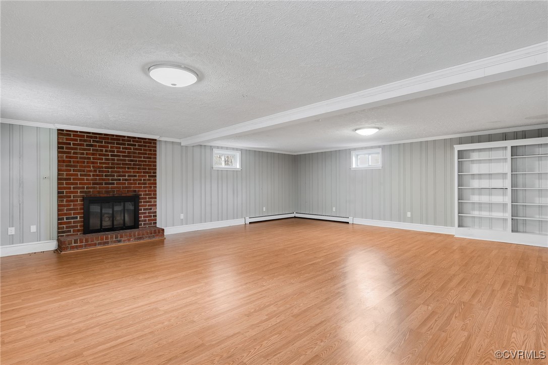 12047 Sunset Drive Ashland, VA 23005 - Photo 17 of 26 a view of an empty room with wooden floor fireplace and a window