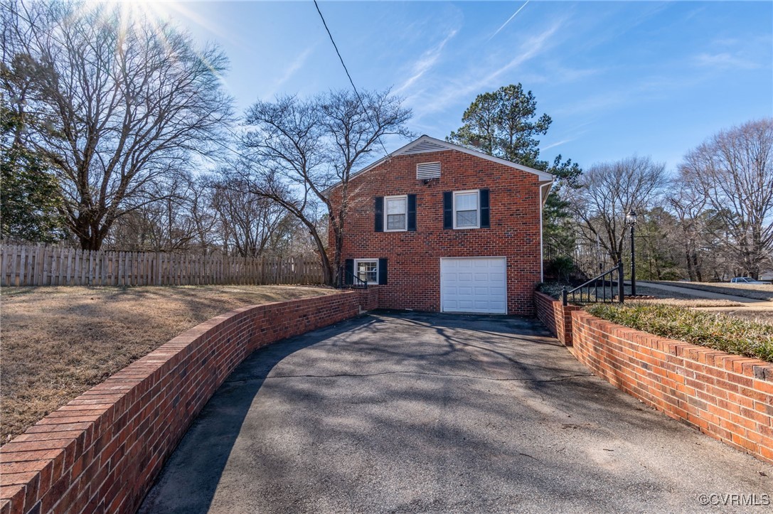 12047 Sunset Drive Ashland, VA 23005 - Photo 21 of 26 a front view of a house with a yard