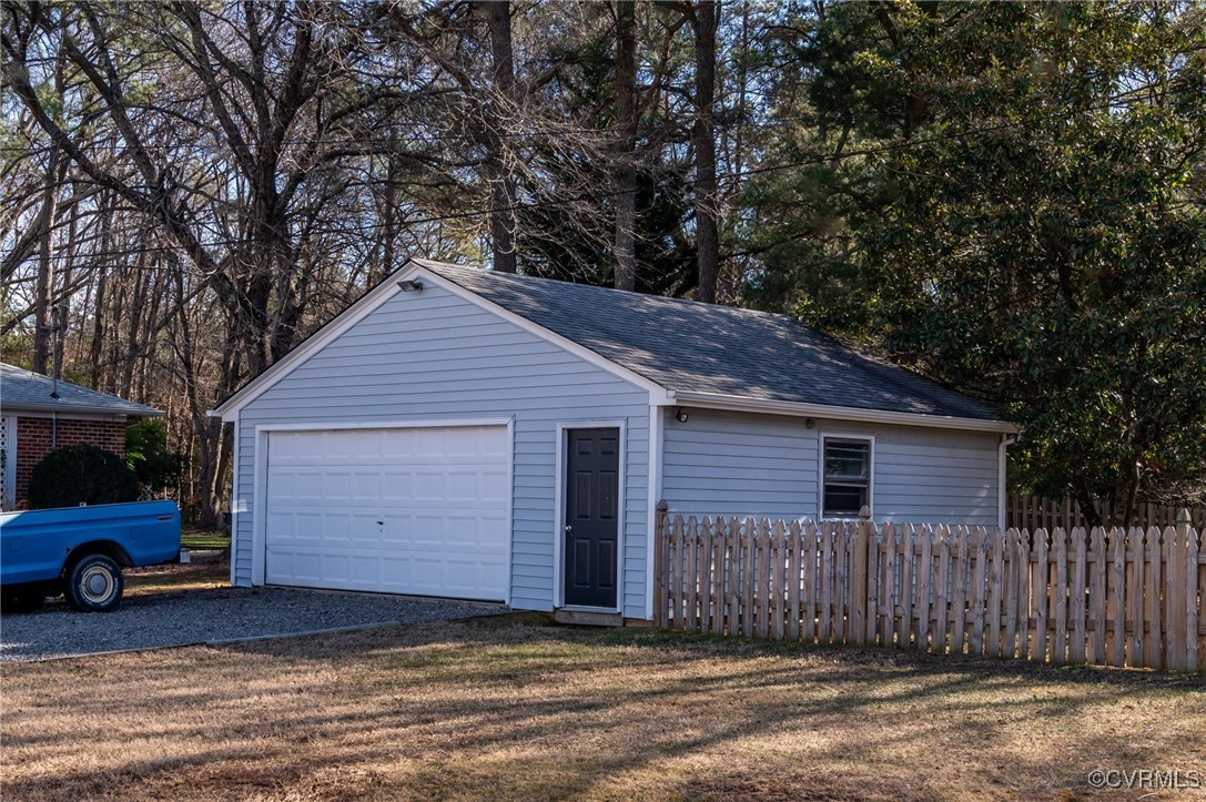 12047 Sunset Drive Ashland, VA 23005 - Photo 26 of 26 a view of a house with a backyard and a garage