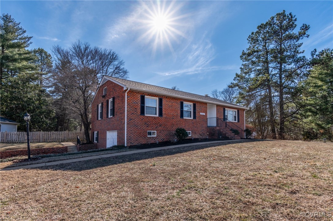12047 Sunset Drive Ashland, VA 23005 - Photo 3 of 26 a front view of a house with a yard