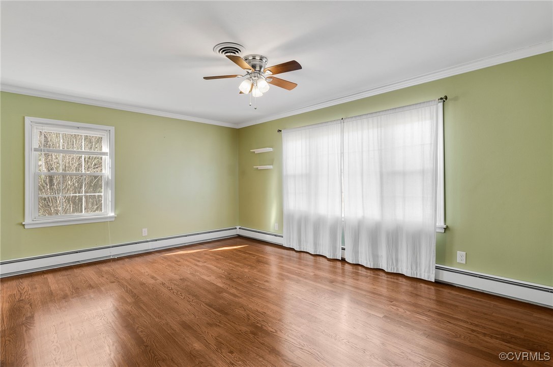 12047 Sunset Drive Ashland, VA 23005 - Photo 4 of 26 a view of an empty room with wooden floor and a window