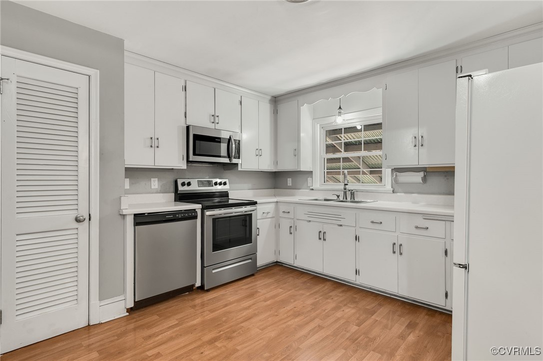 12047 Sunset Drive Ashland, VA 23005 - Photo 9 of 26 a kitchen with granite countertop white cabinets and stainless steel appliances