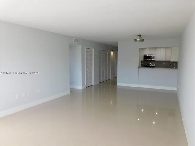 a view of a kitchen with a sink and a dishwasher
