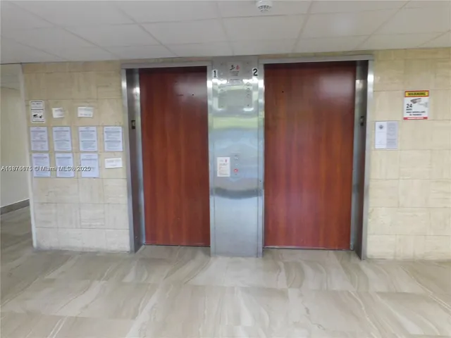 an empty room with closet area