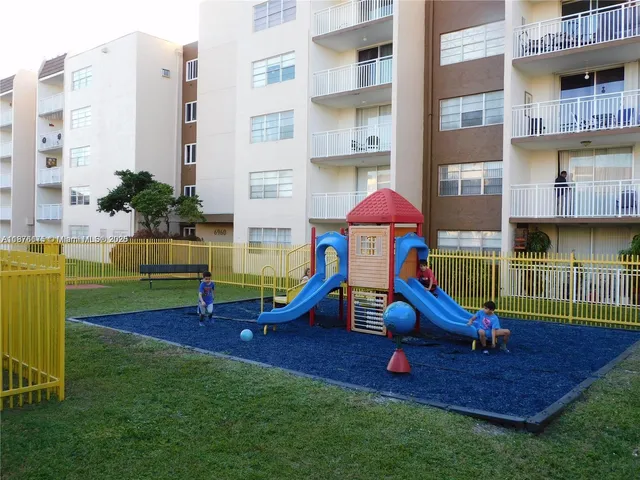 a swimming pool with outdoor seating