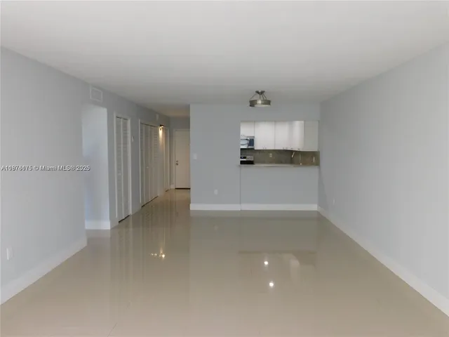 a view of a kitchen with a sink and a window