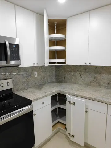 a kitchen with a sink and a window