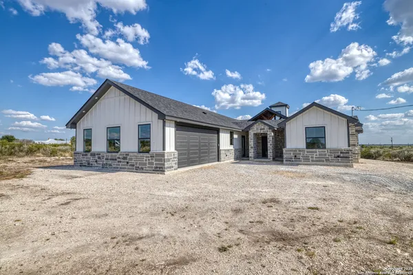a very nice looking house with a yard