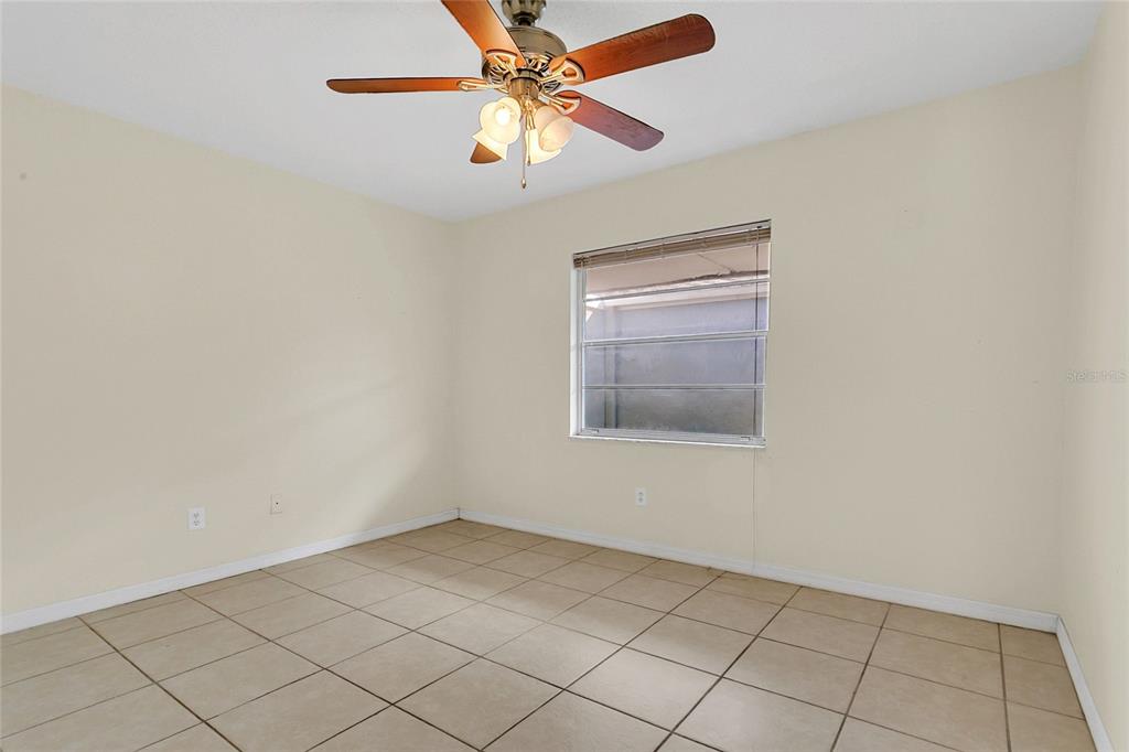 561 East Orange Street Altamonte Springs, FL 32701 - Photo 13 of 24 an empty room with chandelier fan
