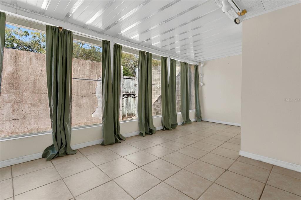 561 East Orange Street Altamonte Springs, FL 32701 - Photo 18 of 24 an empty room with windows