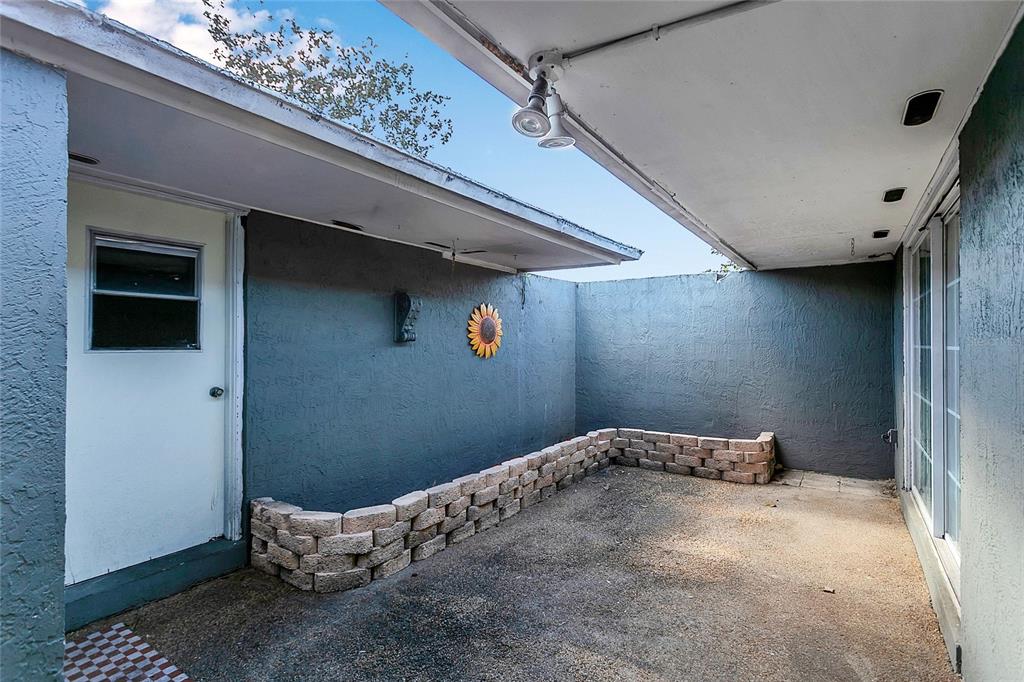 561 East Orange Street Altamonte Springs, FL 32701 - Photo 3 of 24 a bedroom with a bed and a window