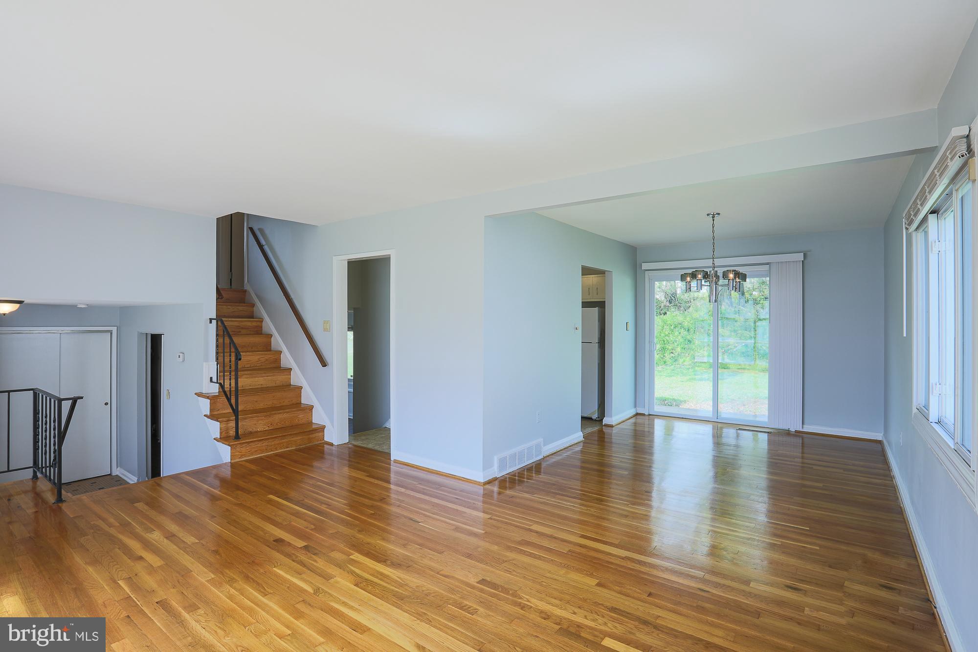 6817 Fox Meadow Road Baltimore, MD 21207 - Photo 8 of 27 Freshly Painted as well and slider leads to patio