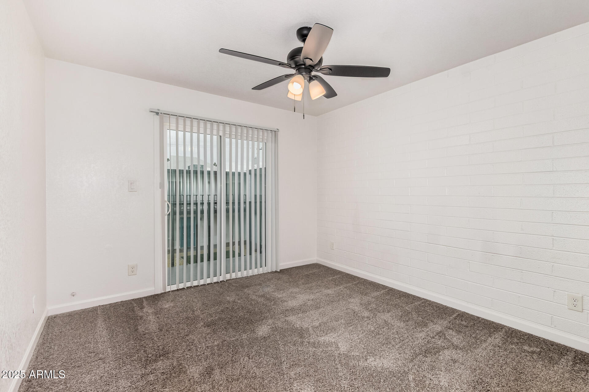 1804 West Tuckey Lane, Unit 1 Phoenix, AZ 85015 - Photo 19 of 25 a view of a livingroom with a ceiling fan and window