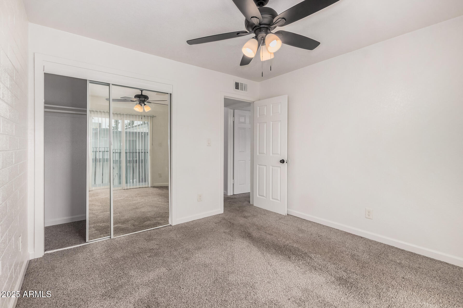 1804 West Tuckey Lane, Unit 1 Phoenix, AZ 85015 - Photo 20 of 25 an empty room with chandelier fan