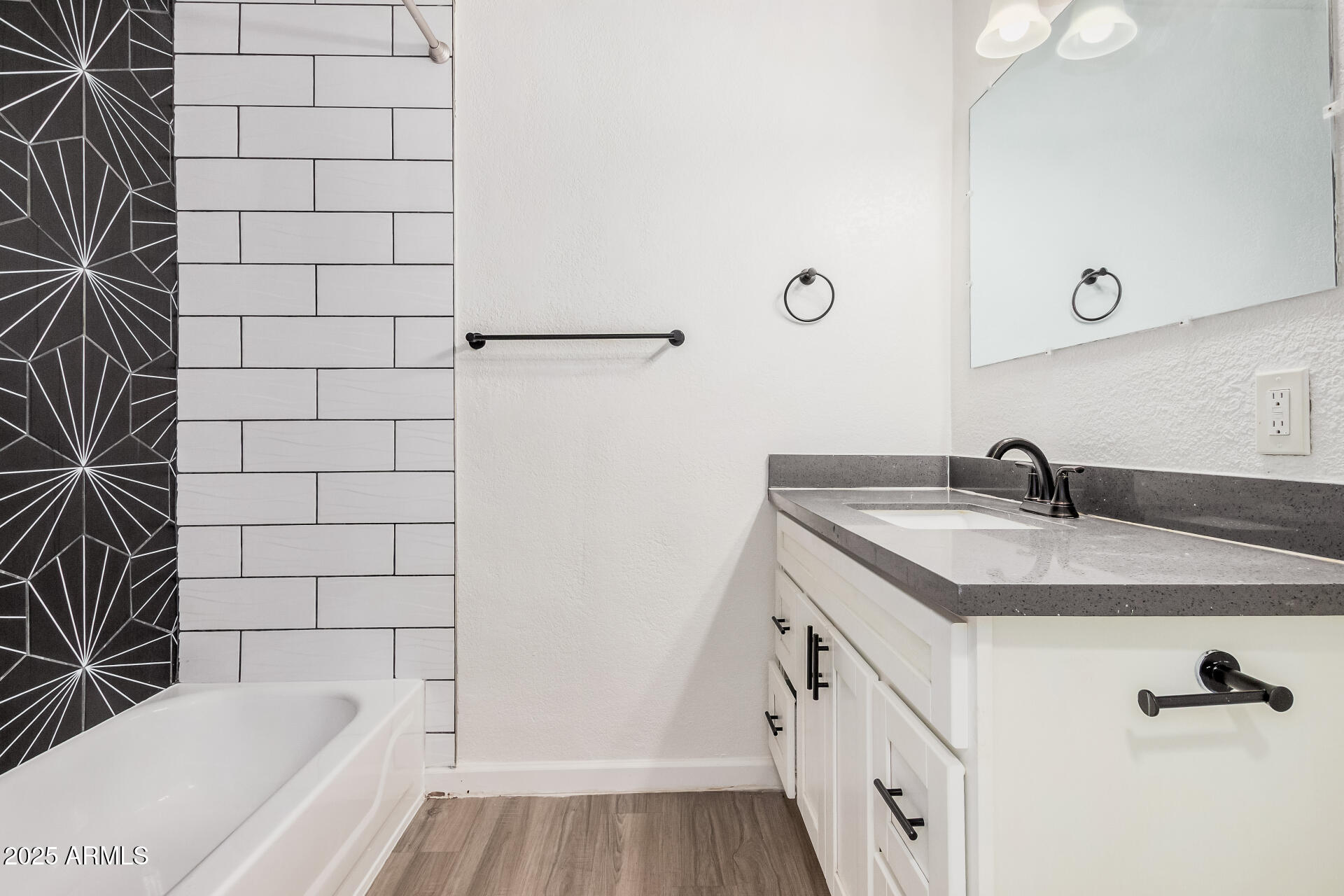 1804 West Tuckey Lane, Unit 1 Phoenix, AZ 85015 - Photo 21 of 25 a bathroom with a sink and a bathtub
