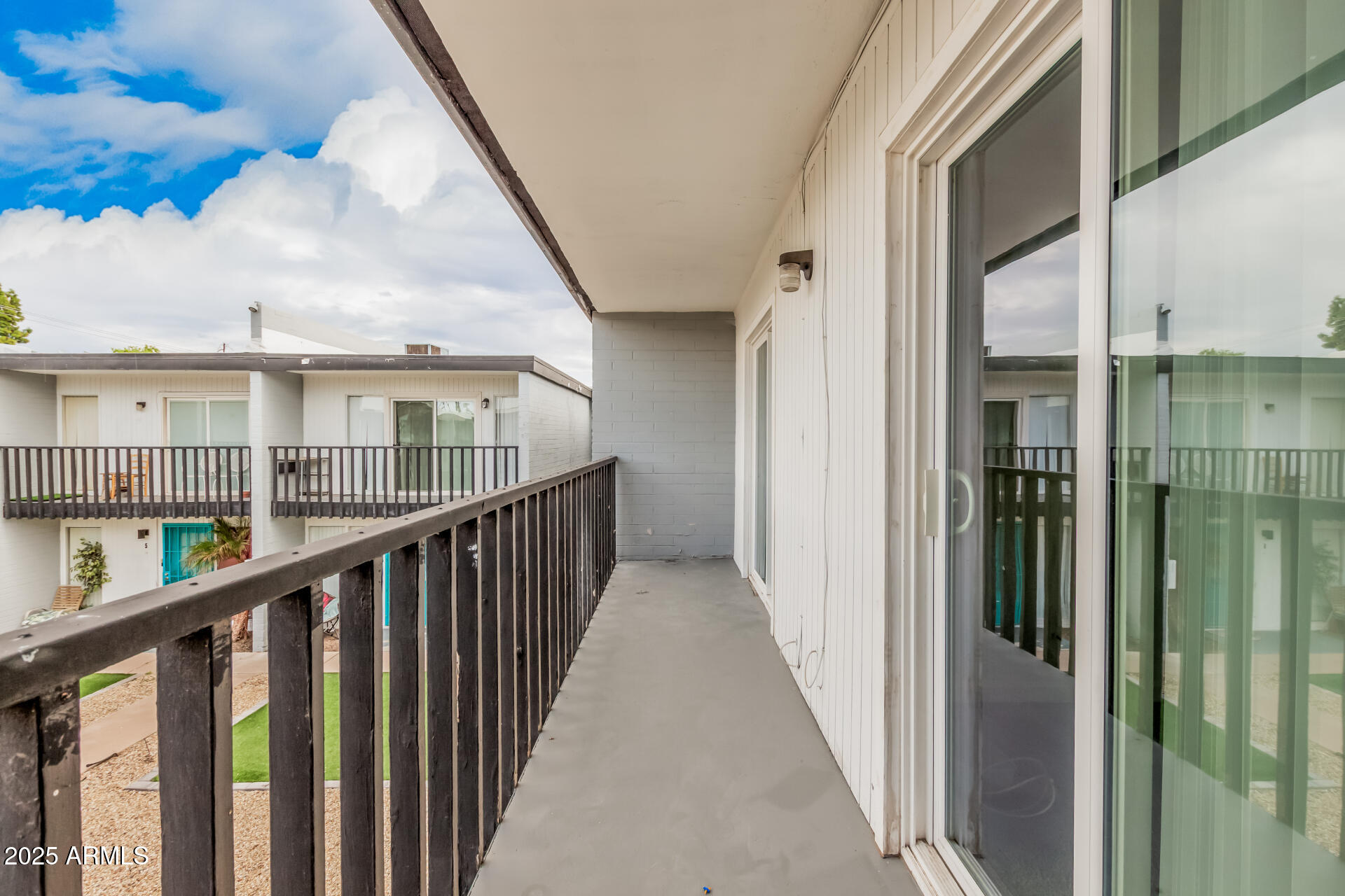 1804 West Tuckey Lane, Unit 1 Phoenix, AZ 85015 - Photo 23 of 25 a view of a balcony with wooden floor