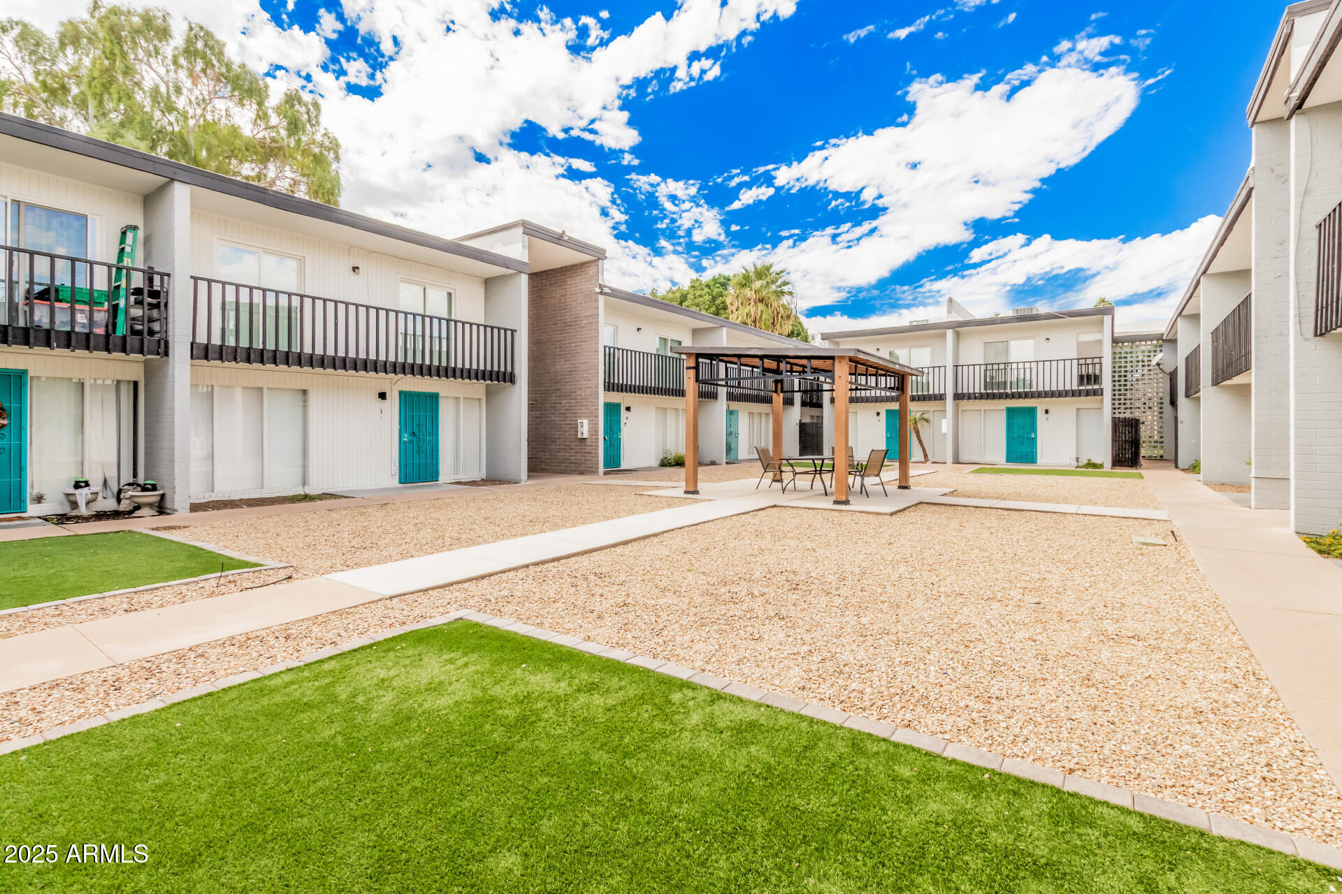 1804 West Tuckey Lane, Unit 1 Phoenix, AZ 85015 - Photo 7 of 25 a front view of a house with a yard