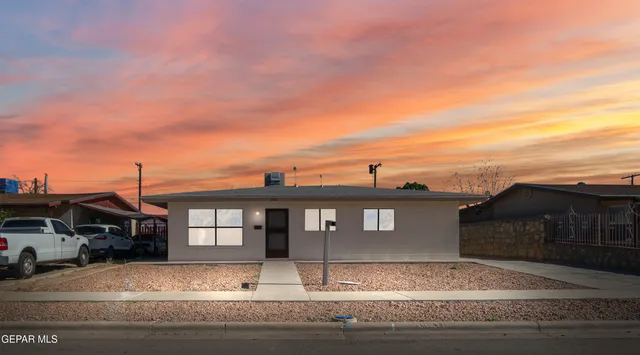 a view of a car park in front of house
