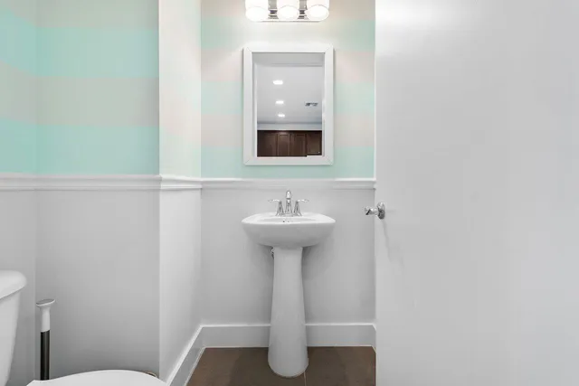 a bathroom with a sink toilet