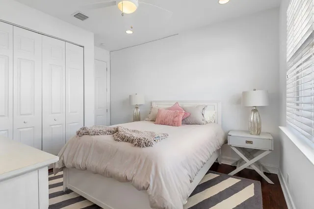 a bedroom with a bed and a lamp