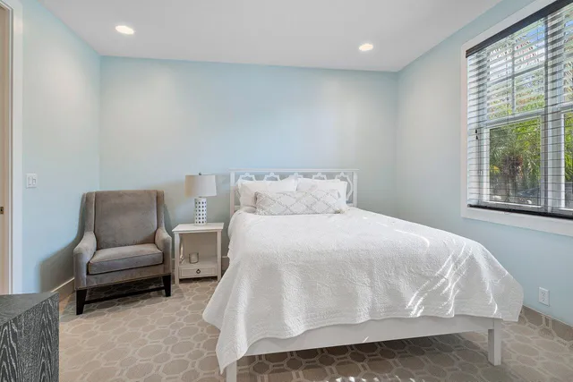 a bedroom with a bed and a couch