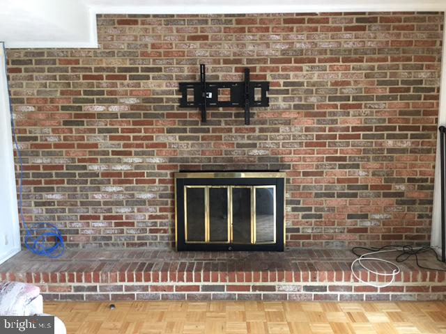 2162 Smoky Road Huntingtown, MD 20639 - Photo 15 of 38 Brick wood burning fireplace in Den/Rec Room