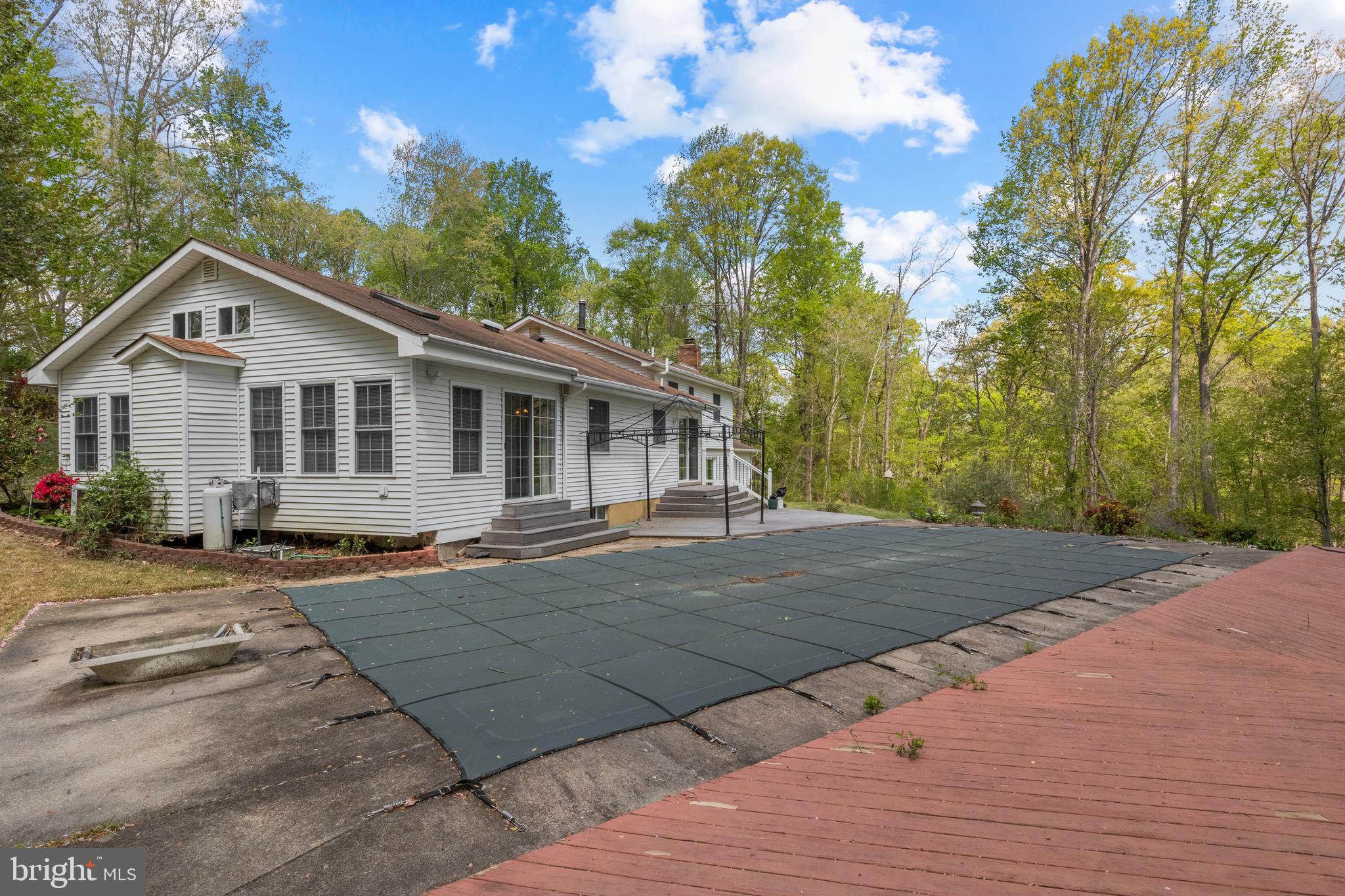 2162 Smoky Road Huntingtown, MD 20639 - Photo 29 of 38 Rear of house with inground POOL and decking