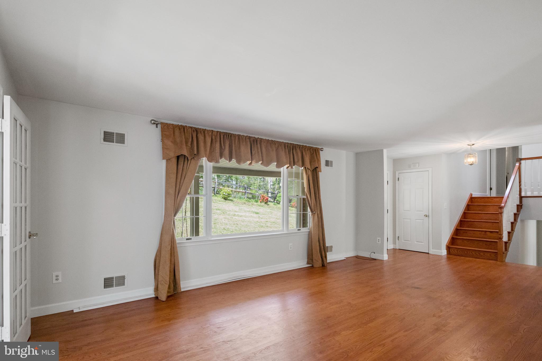 2162 Smoky Road Huntingtown, MD 20639 - Photo 7 of 38 Living room , windows overlooking scenic Frt yard