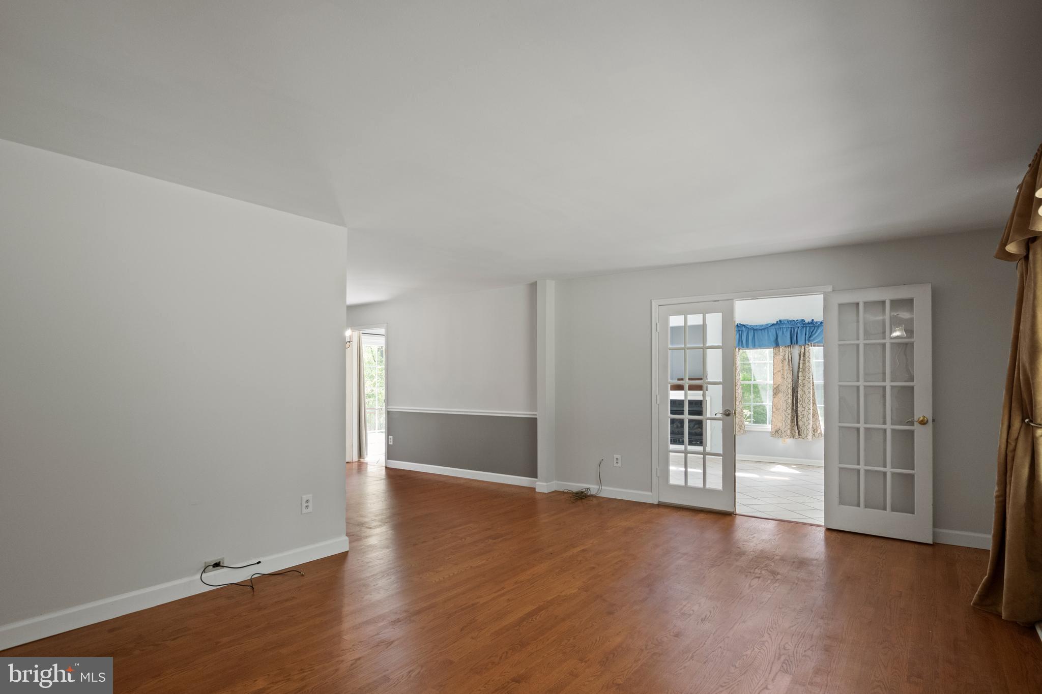2162 Smoky Road Huntingtown, MD 20639 - Photo 9 of 38 Living Room to Sunroom